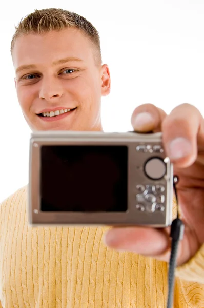 Handsome man showing digital camera — Stok fotoğraf