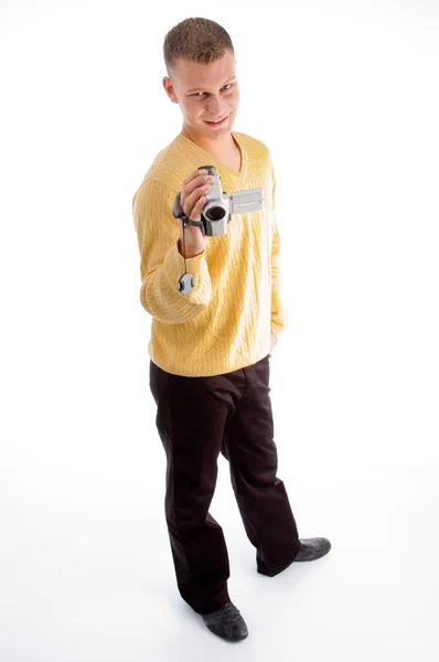 Jovem masculino segurando câmera de vídeo — Fotografia de Stock