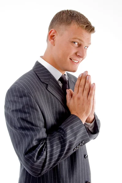 Young businessman praying and smiling — Stock Photo, Image