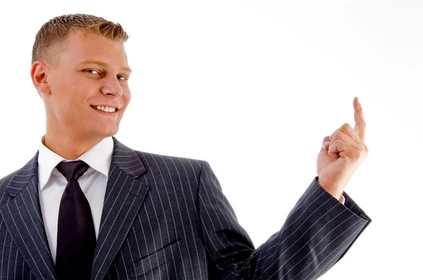 Portrait of smiling pointing businessman — Stock Photo, Image