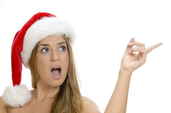 Indicating sexy lady with santa cap — Stock Photo, Image