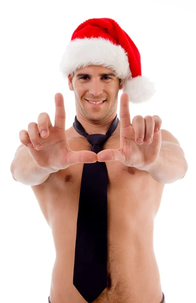 Muscular male with christmas hat — Stock Photo, Image