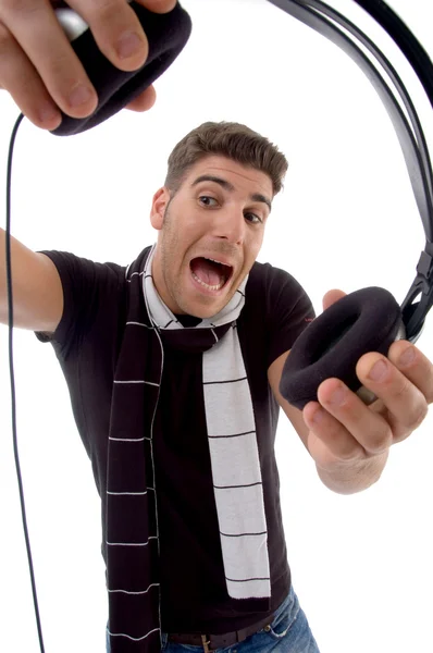 Shouting male holding headphones — Stock Photo, Image