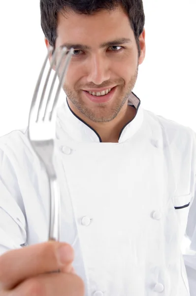 Zblízka šéfkuchaře drží vidličku — Stock fotografie