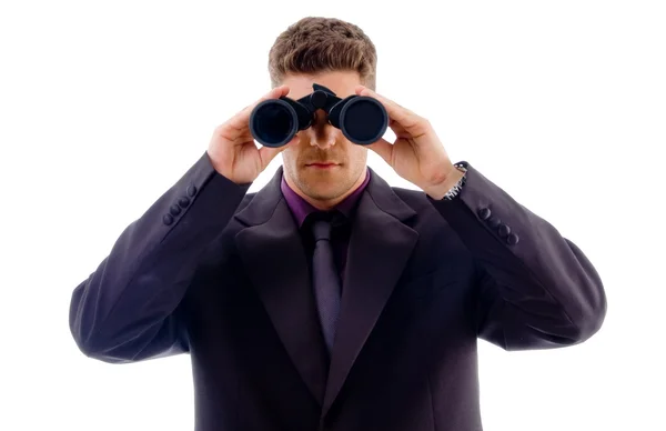 Young businessman with binoculars — Stock Photo, Image