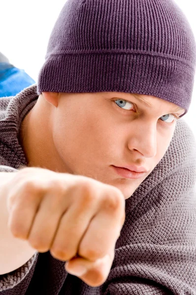 Cool man with winter cap showing fist — Stock Photo, Image