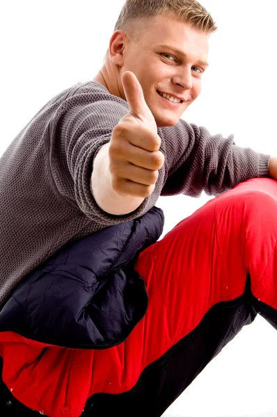 Mladý chlap ukazuje palec — Stock fotografie