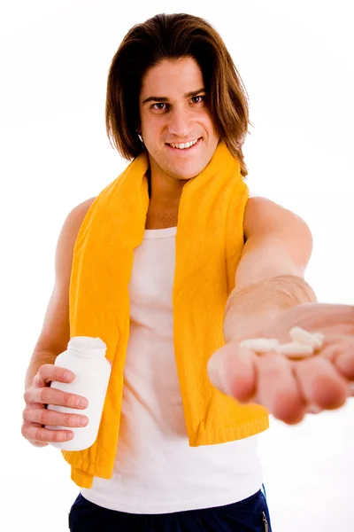 Smiling man showing tablets — Stock Photo, Image