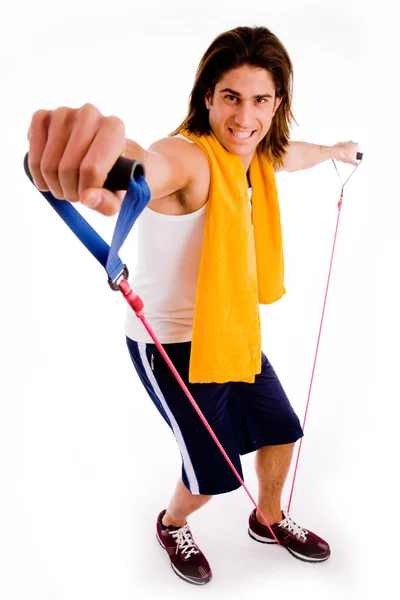 Homem esticando corda — Fotografia de Stock