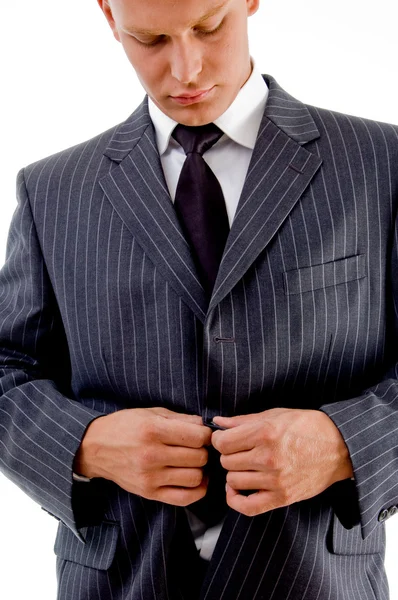 Businessman tucking his coat button — Stock Photo, Image