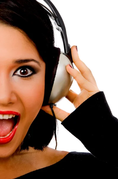 Portrait of happy female listening music — Stock Photo, Image