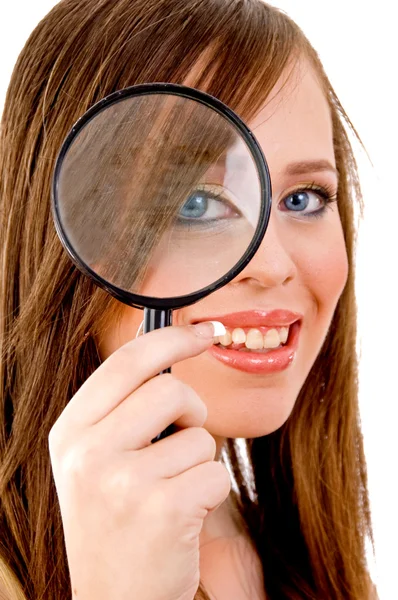 Woman looking through lens — Stock Photo, Image