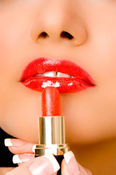 stock image Close up of female applying lipstick