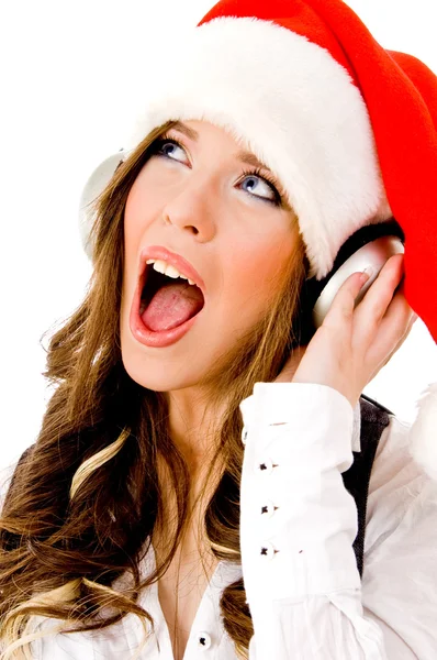 Julmusik kvinna lyssnande — Stockfoto