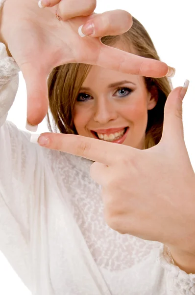Lachende vrouw tonen frame gebaar — Stockfoto