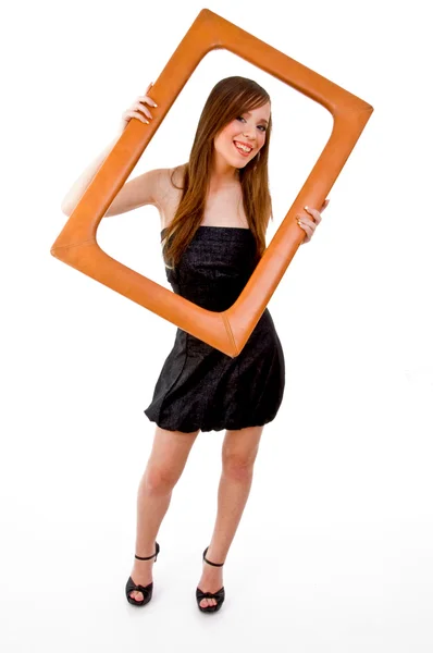Smiling woman holding frame — Stock Photo, Image