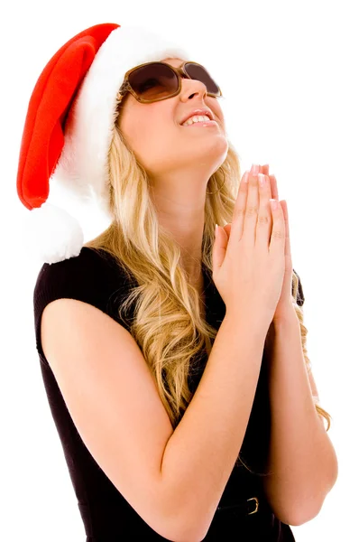 Betende Frau mit Weihnachtsmütze — Stockfoto