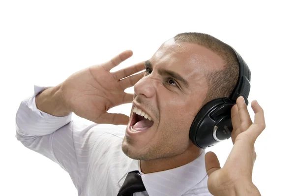 Homem de negócios gritando com fones de ouvido — Fotografia de Stock