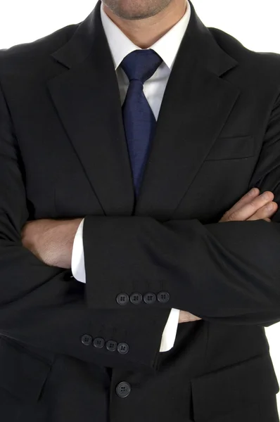 Бизнесмен в костюме со скрещенными руками Лицензионные Стоковые Изображения