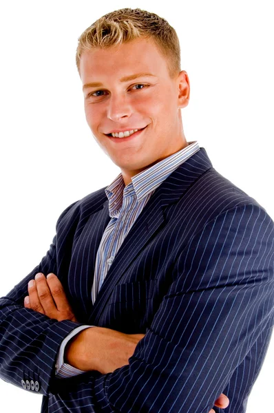 Homme d'affaires souriant aux bras croisés Photo De Stock