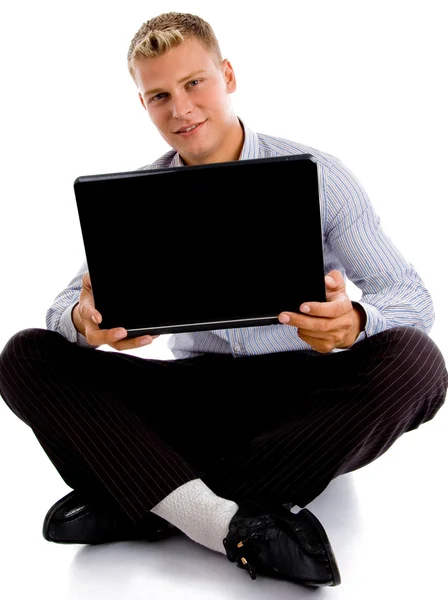 Sitting man with notebook smiling Stock Photo