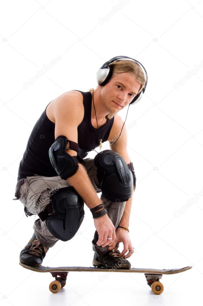 Male listening to music on skate board