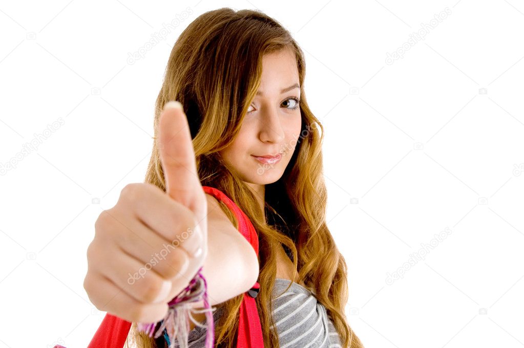 Beautiful teenager showing thumbs up