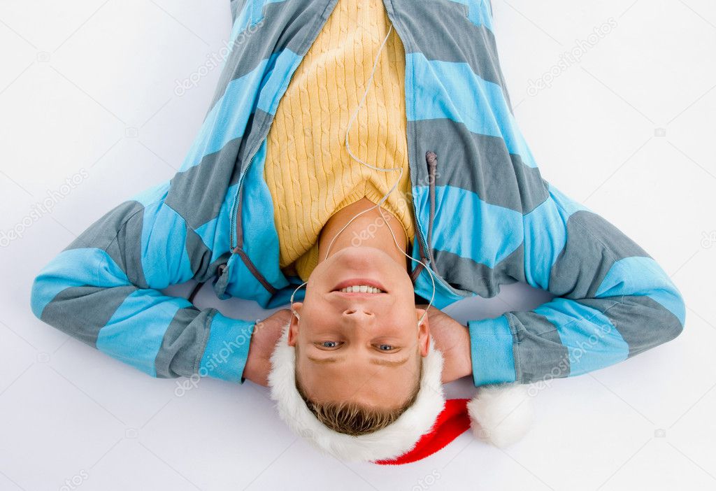 Man with christmas hat on floor