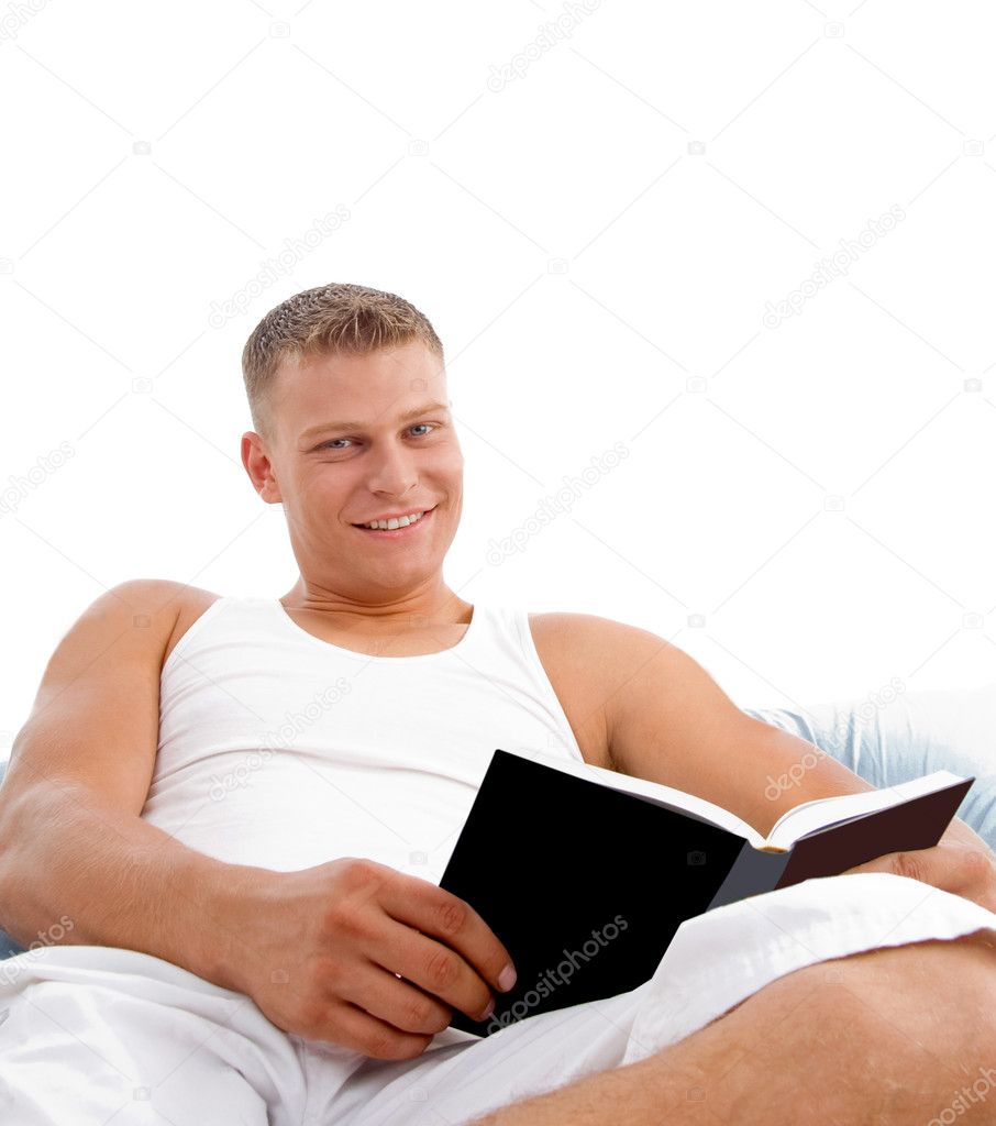 Man enjoying reading in bed