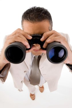 Businessman looking through binoculars clipart