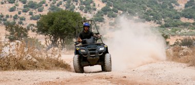 Rider on his four wheel ATV clipart