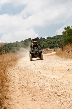 Young couple on atv clipart