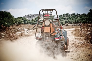 ATV aggressively crossing trail clipart