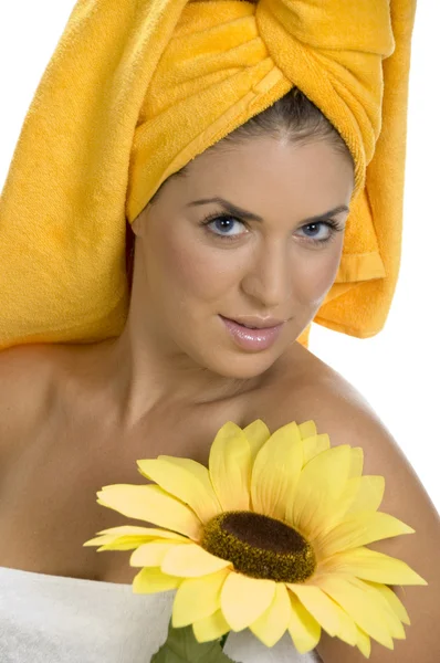 Sexy female in towel with sunflower — Stock Photo, Image