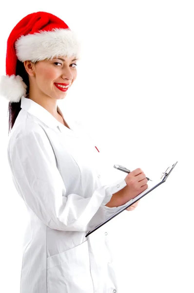 Smart doctor wearing christmas hat — Zdjęcie stockowe