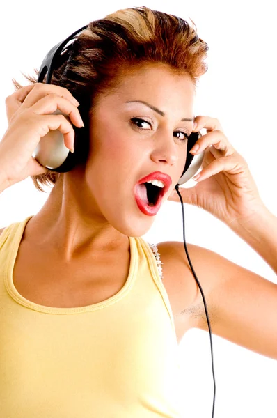 Charming model listening music — Zdjęcie stockowe