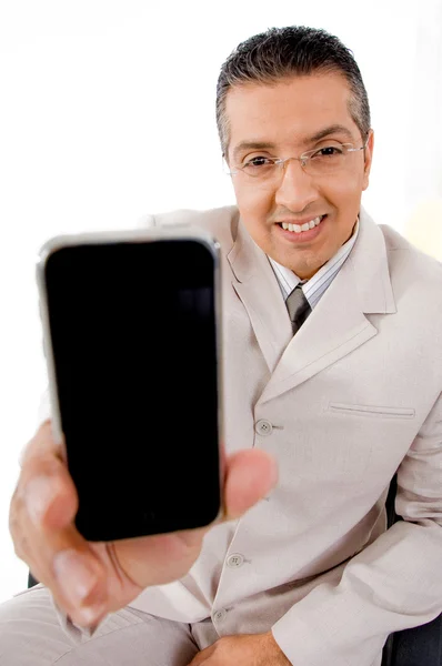 Üzletember kínál mobiltelefon — Stock Fotó