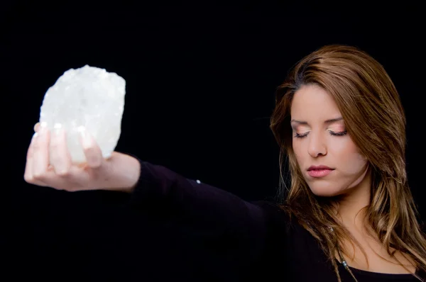 stock image Young woman holding stone