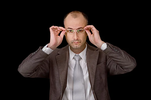Aged male putting up glasses — Stock Photo, Image