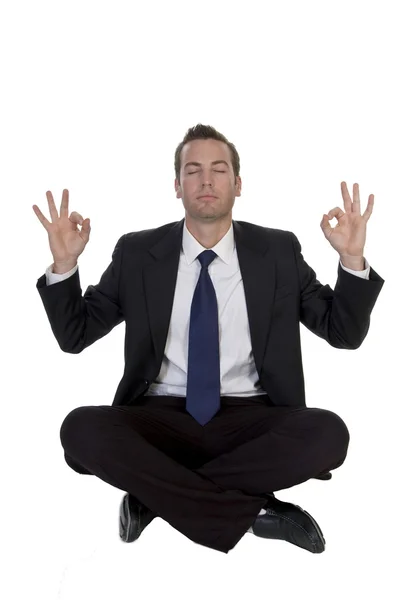 Young businessman meditating — Stock Photo, Image