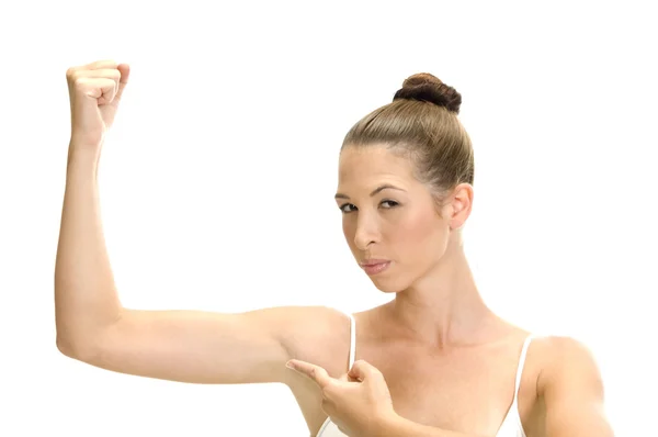 Kobieta wskazując jej mięśnie — Zdjęcie stockowe