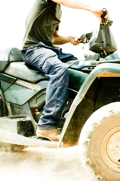 Close-up of sportsman riding his quad — Stock Photo, Image