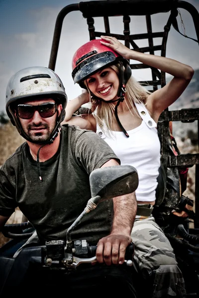 stock image Happy young couple on ATV