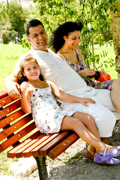 Jolly family resting in shade — Stock Photo, Image