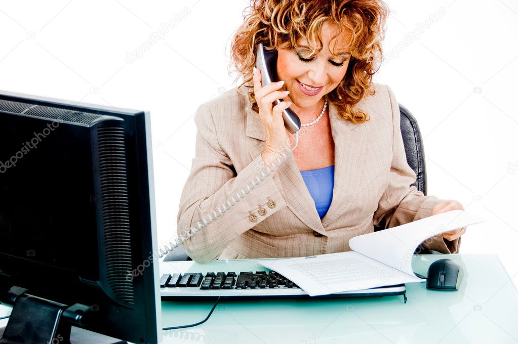 Corporate woman busy looking at file