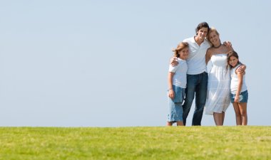 Portrait of happy family of four clipart