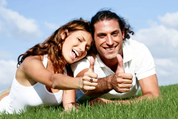 Man and lady showing thumbs up — Stock Photo, Image