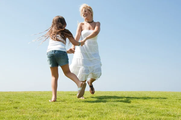 Young mother enjoying with her daughter — Stock Photo, Image
