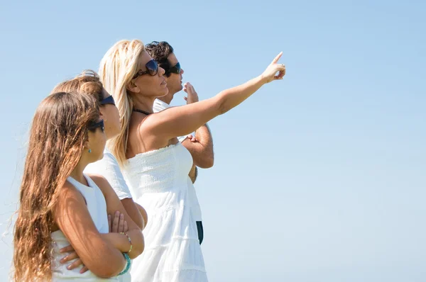 stock image Woman pointing towards sky