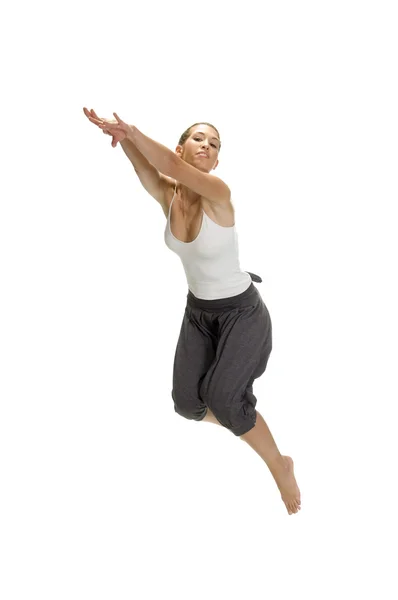 Caucasian woman leaps in air — Stock Photo, Image